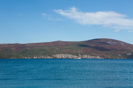 white large yacht stands at the pier in the town of Tivat Montenegro