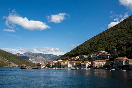 Boko-Kotor Bay, Montenegro - September 21: view of the Boka Kotor Bay with the ferry house and the mountains in the fall in the European day of languages on September 21, 2017のeditorial素材