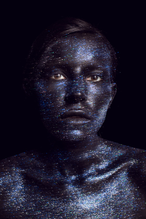 portrait of a black girl painted with paintの写真素材