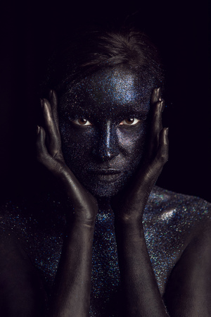 portrait of a black girl painted with paintの写真素材