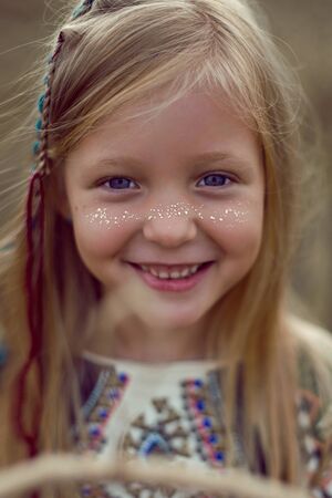 girl Indian shaman blonde in a poncho and a dream catcherの写真素材
