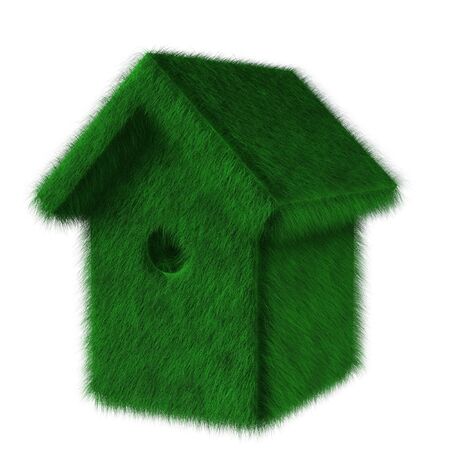 Green ecologic birdhouse covered with grassの写真素材