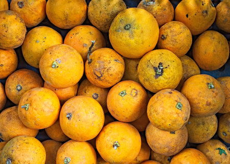 Orange fruit in the market. Close up of orange fruit background.