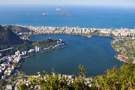 Rodrigo de Freitas Lagoon. Rio de Janeiro, Ipanema Beach, view of Lagoa Rodrigo de Freitas lake and South Atlantic Ocean in the background in Rio de Janeiroの写真素材