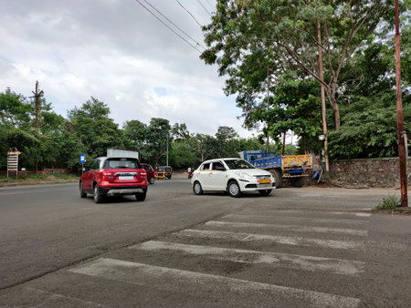 Pune Maharashtra India 09-10-2021 Not so clear Zebra crossing on a road as seen on a cloudy dayのeditorial素材
