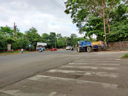 Pune Maharashtra India 09-10-2021 Not so clear Zebra crossing on a road as seen on a cloudy dayのeditorial素材