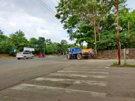 Pune Maharashtra India 09-10-2021 Not so clear Zebra crossing on a road as seen on a cloudy dayのeditorial素材