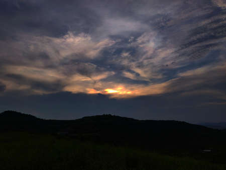 Beautiful Purple Yellow Sky as seen from a hillの写真素材