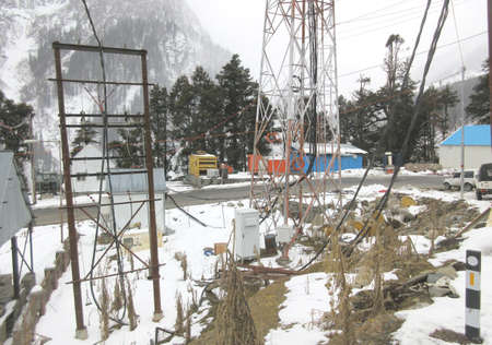 A transformer in cold region snow covered area,It is a passive component that transfers electrical energy from one electrical circuit to another circuitの写真素材