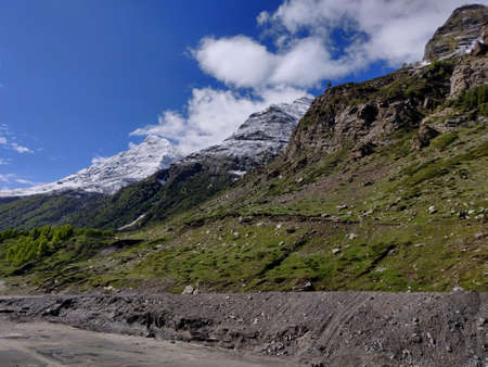 Snow-capped mountains in the background as seen while travelling from Manali to Lehの写真素材