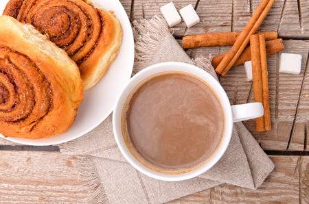 A cup of cocoa and buns.の写真素材