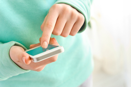 Female using her mobile phone.の写真素材