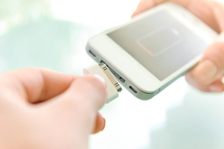 Charging of mobile phone.
