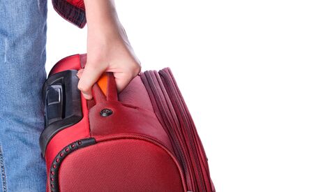 Woman holds suitcase in hands.の写真素材