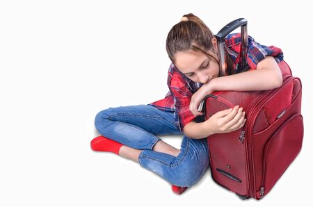 Young girl with suitcase. Isolated on white.の写真素材