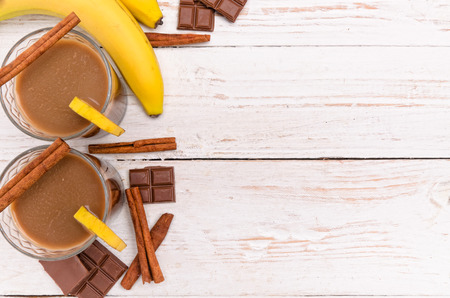 Chocolate banana smoothie in a glass. Background.の写真素材
