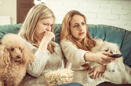 young couple watching tvの写真素材