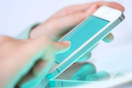 Female using her mobile phone.の写真素材