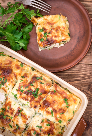 Chicken lasagna and white cheese.の写真素材