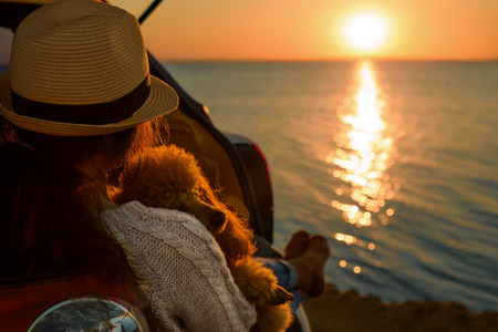 Woman watching a sunsetの写真素材