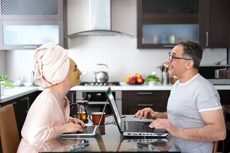 The happy woman and man are working remotely.の写真素材
