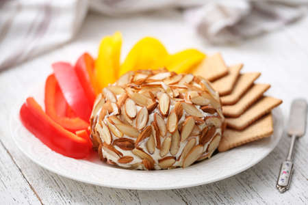 Homemade Classic Cheese Ball with crackers and sliced vegetables.の写真素材