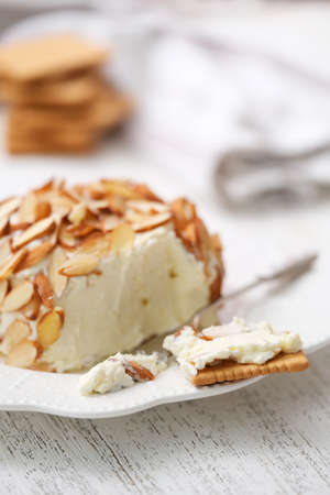 Homemade classic cheese ball with crackers.の写真素材