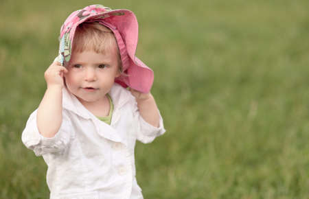 beautiful little girl in hatの写真素材