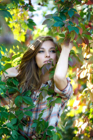 blond girl posing outdoorの写真素材
