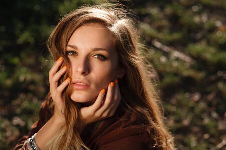 beautiful girl hands on faceの写真素材