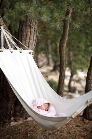baby sleeping in hammockの写真素材
