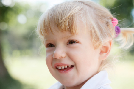closeup portrait of little girl smilingの写真素材