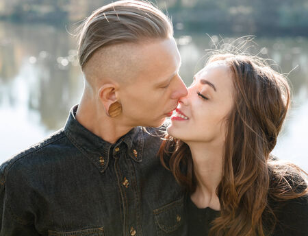 young male and female kissingの写真素材