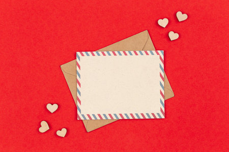 Envelope and blank postcard on a red background, Valentines Day concept.の写真素材