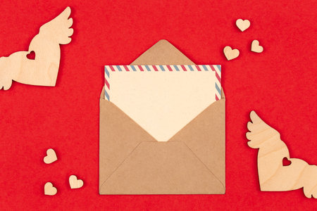 Envelope and blank postcard on a red background, Valentines Day.の写真素材