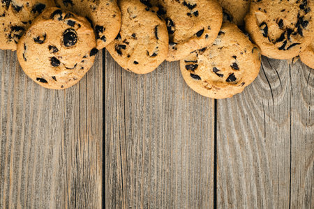 Traditional chocolate chip cookies on rustic wooden table, copy space.の写真素材