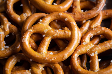 Background texture of salted mini pretzels in traditional loop shape.の写真素材