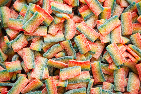 Background of chewy gelatin sweets covered with sugar.の写真素材