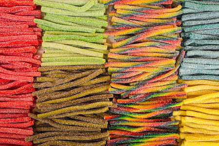 Assorted gummy candies and jellies on street market shop.の写真素材