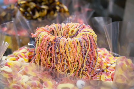 Candy background, chewing jelly candies in the form of worms, close-up.