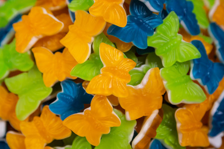 Colorful jelly candies in the form of butterfly, candy background.の写真素材