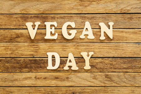 The inscription Vegan Day made of wooden letters on a wooden background.の写真素材
