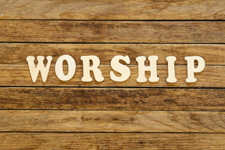 Word Worship written with wooden letters on wooden background.の写真素材