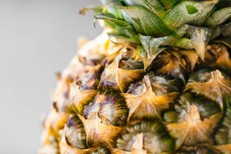 Close-up of pineapple peel background, macro shot.の写真素材