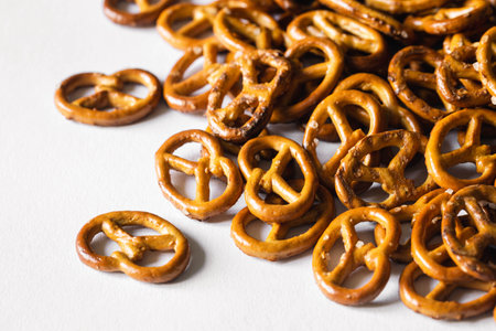 Salted mini pretzels on a white background isolated.の写真素材