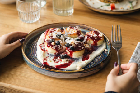 Cheesecakes with fresh berries, hazelnuts and coconut chips.