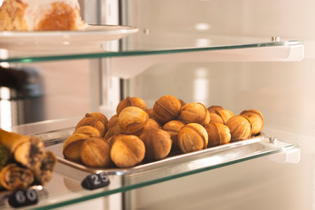 Walnut shaped cookies with boiled condensed milk in the bakery window.