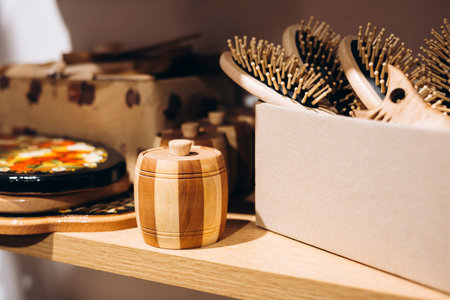 Wooden barrel, combs, and cutting boards in natural wood products store.の写真素材