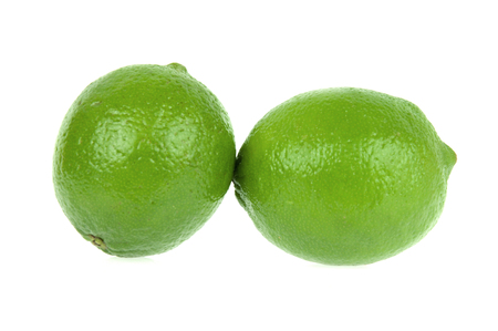 Lime. Two ripe fruits isolated on white backgroundの写真素材
