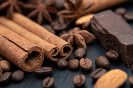 Spicy background. Cinnamon, chocolate, coffee beans and star aniseの写真素材